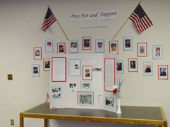 A poster made for Ray's memorial on the military table at Temple