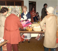 Craft Fair at church 1980, taken in Lower Auditorium.  Bev Loy behind the table