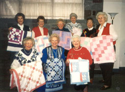 Just a few crib quilts 1996-1996 Back row- Joan Bidgood, Maydora Johnson, Barbara Savage, Frances Brandon, Sumi Shimamura, Edith Ryberg. Front row- Betty Carlson, Marilyn Nelson, Bev Loy.