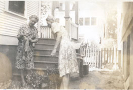 Ruth Johnson and Freda Wennermark between 1319 house and church